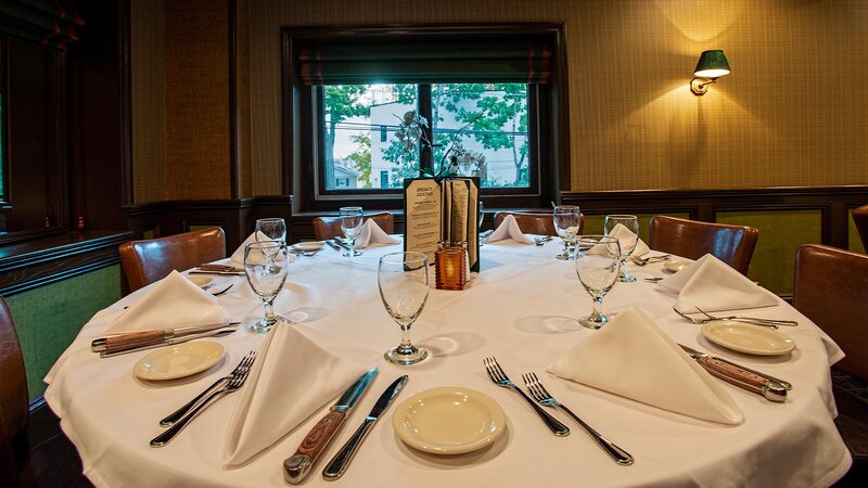 Large table set up in the upstairs dining room